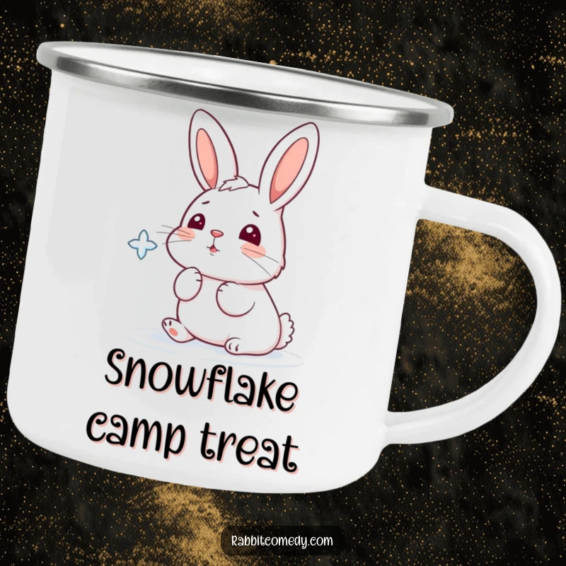 Funny camping mug showing a cartoon rabbit playfully trying to catch a falling snowflake with its nose.