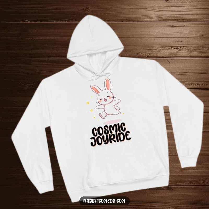 Funny rabbit hoodie showing a rabbit in a joyful leap, trailing shimmering star dust, embodying humorous celestial wonder.
