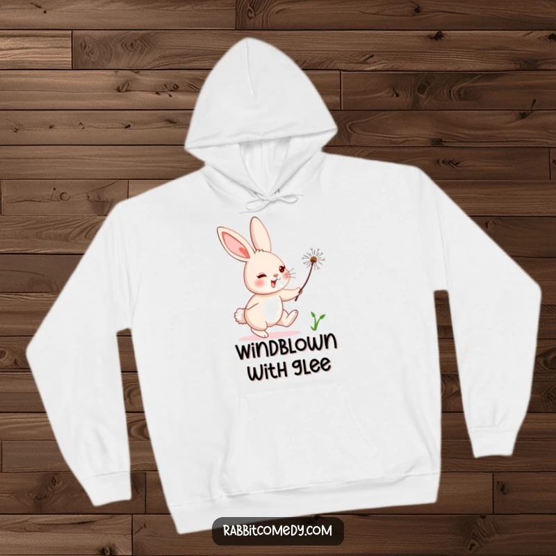 Funny rabbit character comically chasing a floating dandelion seed, printed on a warm and humorous hoodie.