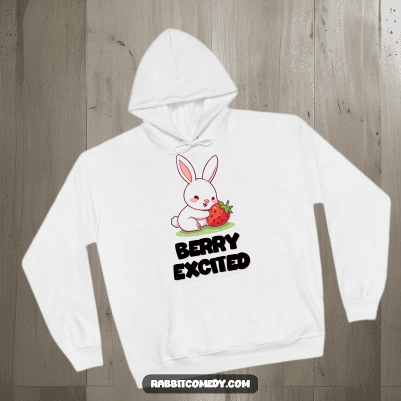 Funny hoodie depicting a rabbit with an excited, wiggling nose, discovering a delicious hidden strawberry, exuding pure joy and warmth.