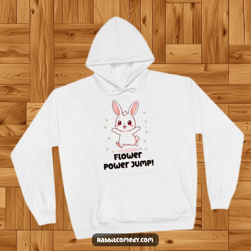 Funny rabbit hoodie with an excited bunny jumping and scattering flowers, designed for cozy comfort and radiating cheerful, energetic vibes.