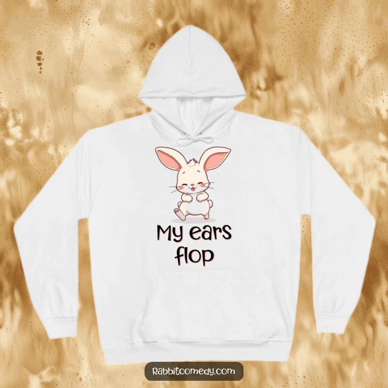 Funny hoodie depicting a cartoon rabbit comically tripping over its own enormous floppy ears, offering warmth and humor for casual wear.