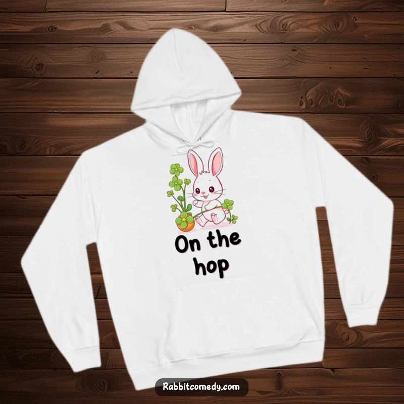 Funny rabbit character gleefully pursuing a rolling clover, its eyes twinkling with mischief, printed on a warm hoodie.