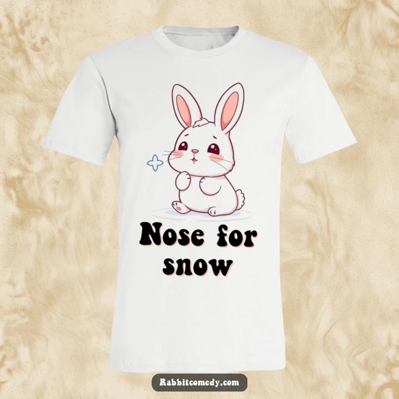 Funny t-shirt featuring a cartoon rabbit playfully attempting to catch a delicate falling snowflake with its nose.